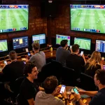 Experience thrilling kết quả bóng đá updates as patrons cheer in a busy sports bar during live matches.