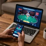 Person engaging with the SAOBET app for online casino gaming on smartphone, showcasing strategic gameplay in a cozy environment.