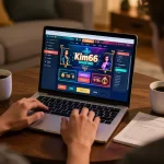 Player accessing the kim66 online casino on their laptop in a cozy home setting, illustrating engaging gameplay and strategic preparation