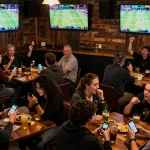 Enjoy thrilling sports betting at F168 with friends during live game action and celebrations.