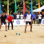 Petanque players engaged in a match, promoting fopikotabontang.org and community sports spirit.