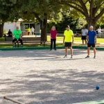 Engaging petanque match at fopikotapontiana.org community event with diverse players enjoying the game.