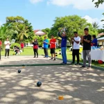 Petanque players engaging in friendly competition at fopikotagorontal.org event showcasing community spirit and outdoor sports.